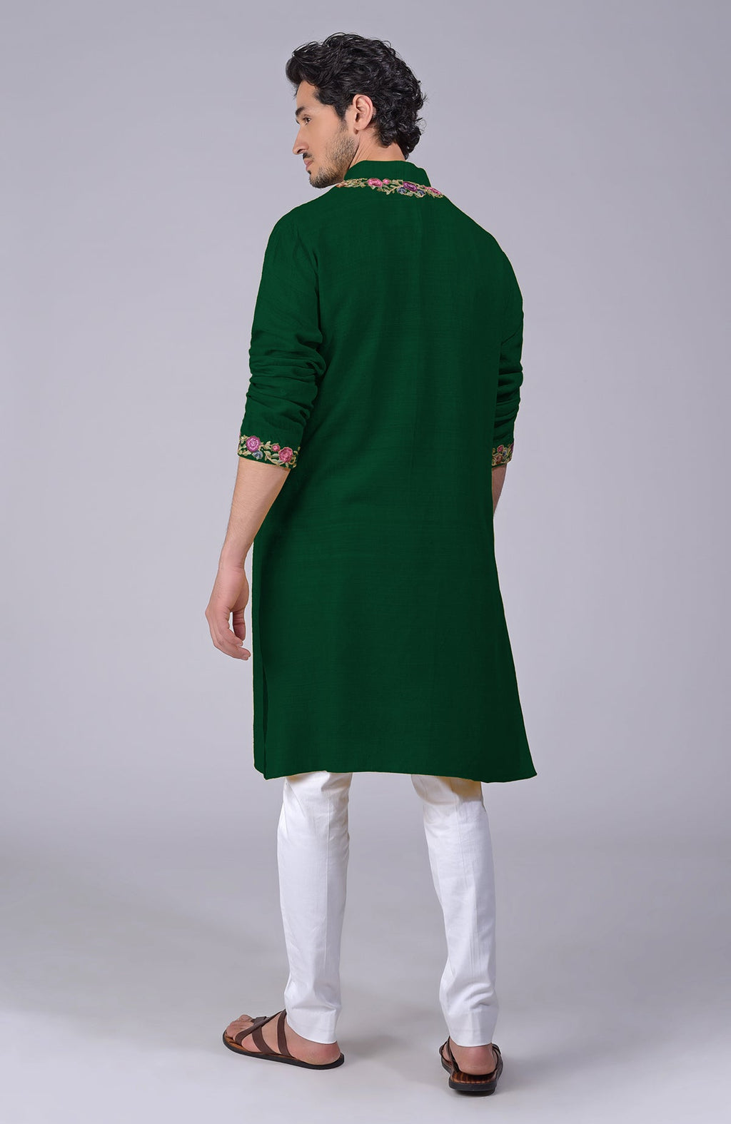 Bottle green kurta with Parsi Gara embroidery on placket, neckline, and sleeves.