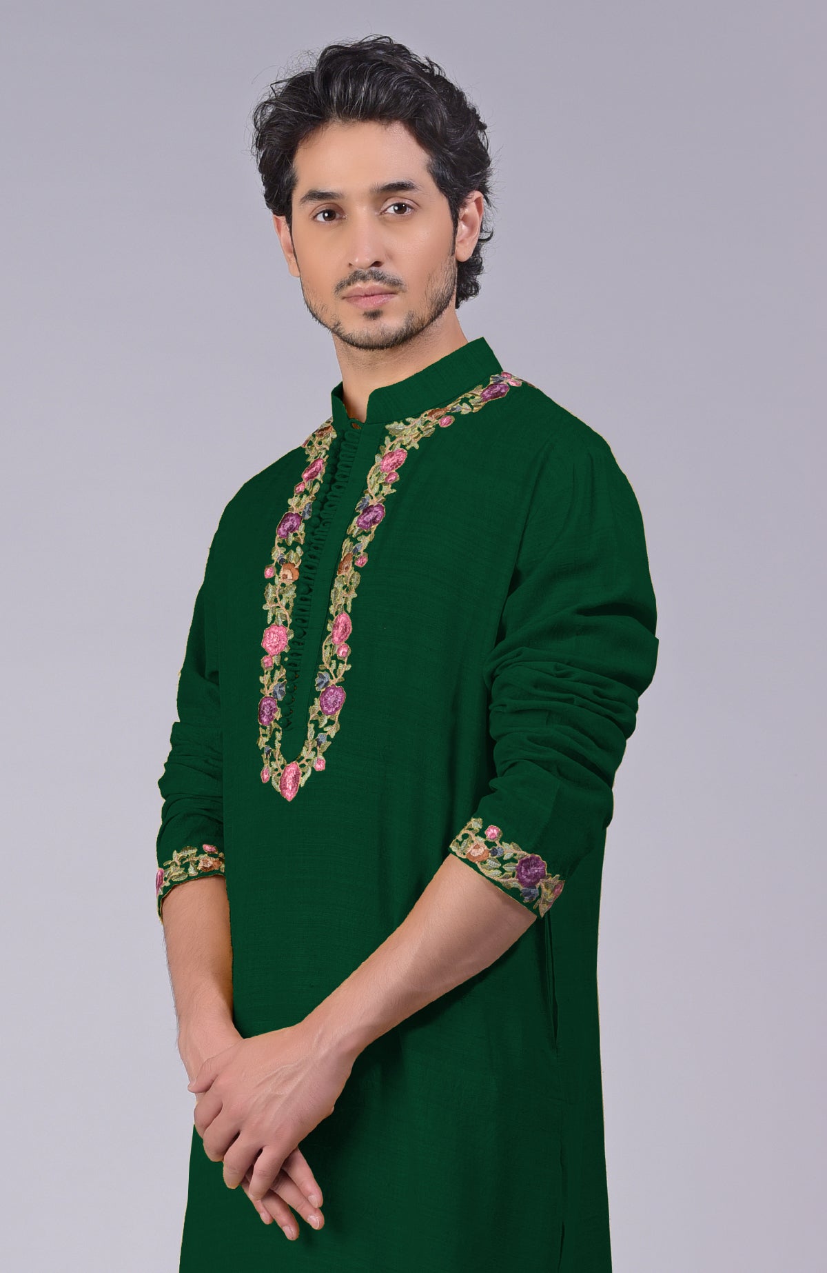 Bottle green kurta with Parsi Gara embroidery on placket, neckline, and sleeves.