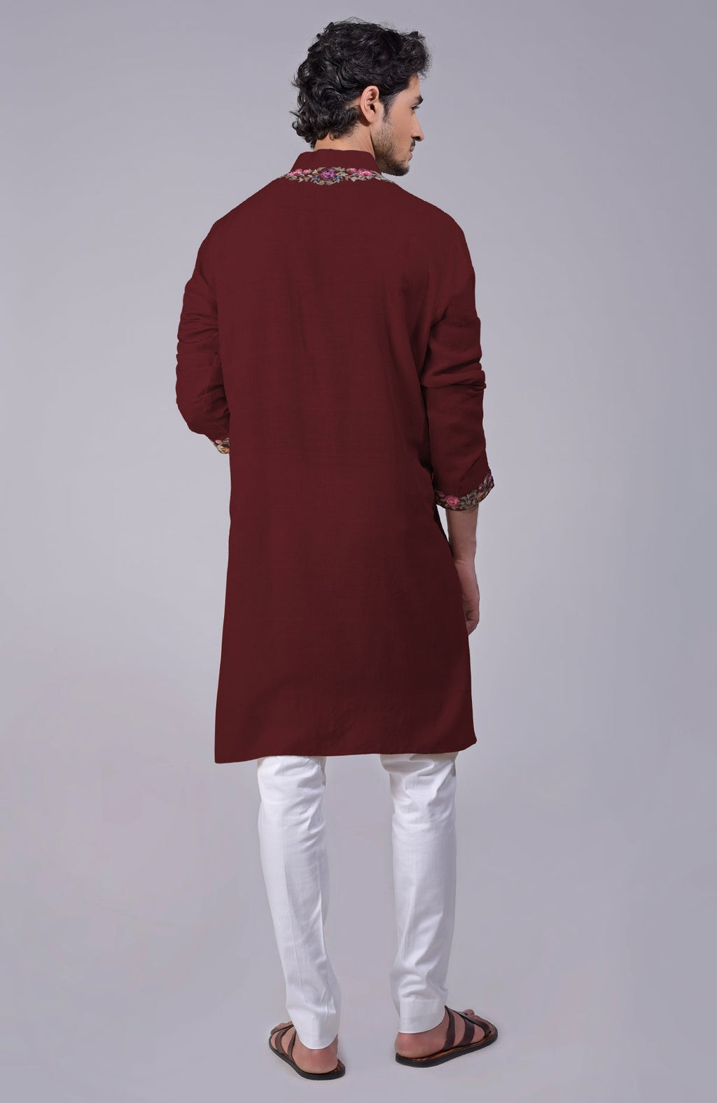 Maroon kurta with Parsi Gara embroidery on placket, neckline, and sleeve ends.