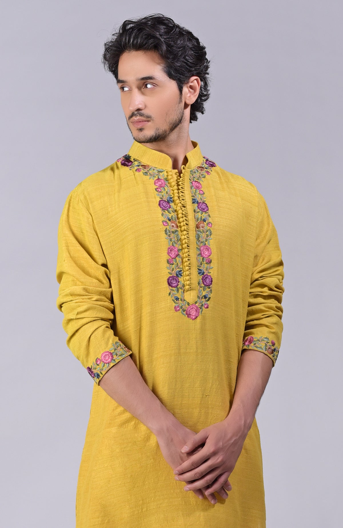 Misted marigold yellow kurta with Parsi Gara embroidery on placket, neckline, and sleeves.