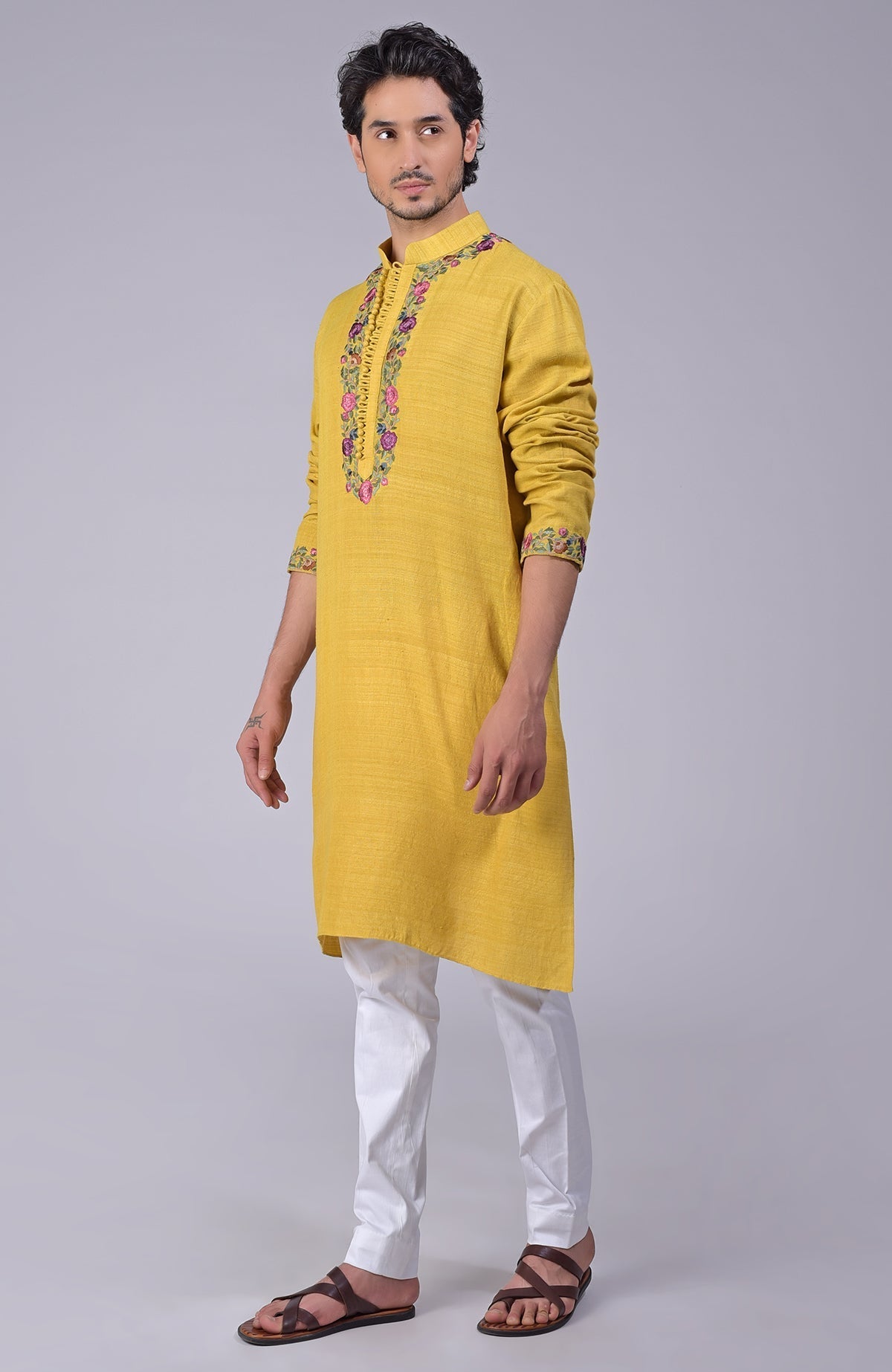 Misted marigold yellow kurta with Parsi Gara embroidery on placket, neckline, and sleeves.