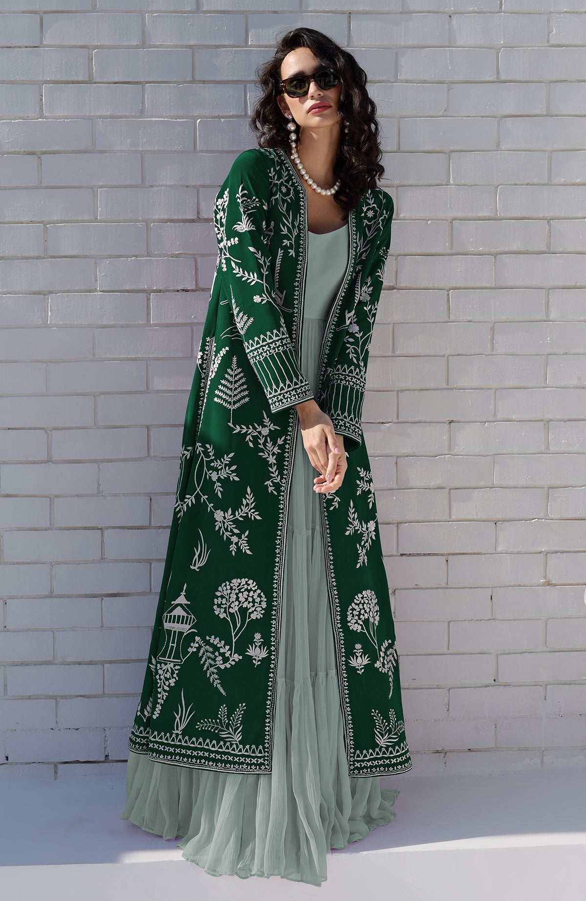 Emerald green jacket with ivory Parsi Gara embroidery and detailed borders on hems and sleeves