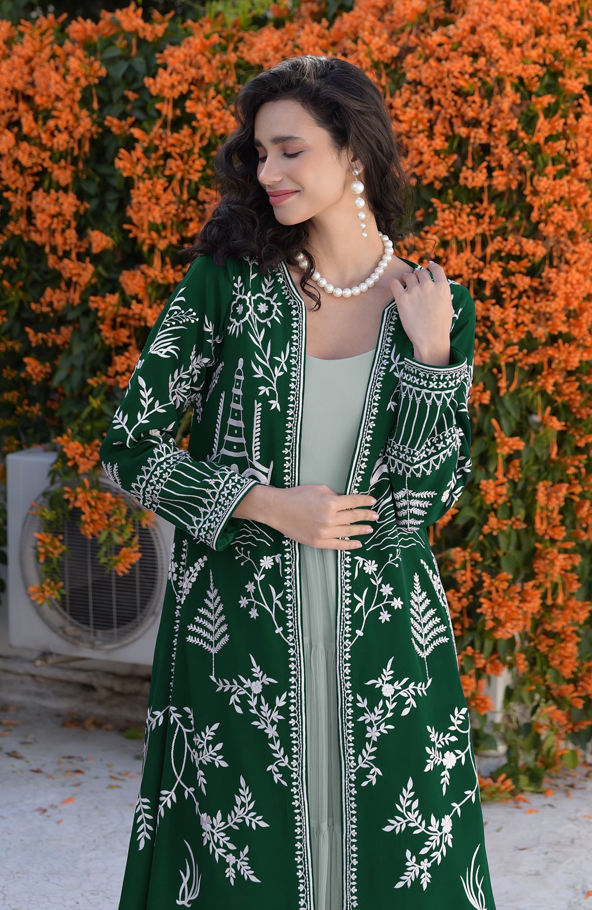 Emerald green jacket with ivory Parsi Gara embroidery and detailed borders on hems and sleeves