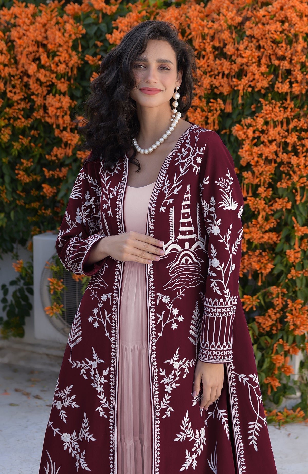 Emerald green jacket with ivory Parsi Gara embroidery and detailed borders on hems and sleeves