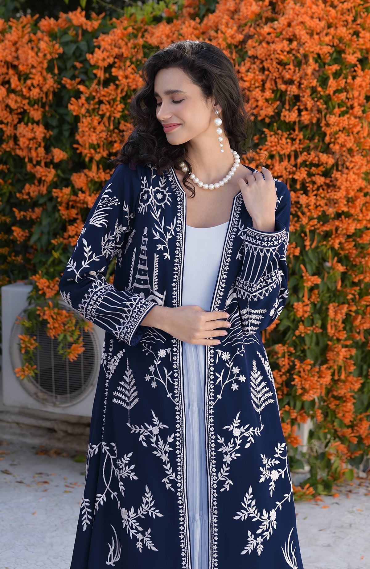 Navy blue jacket with ivory Parsi Gara embroidery and detailed borders on hems and sleeves