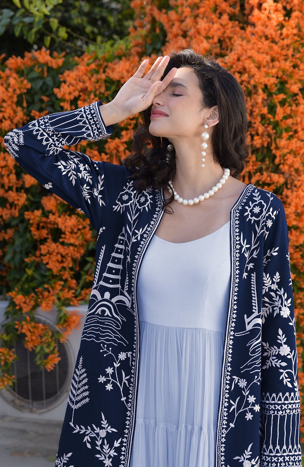 Navy blue jacket with ivory Parsi Gara embroidery and detailed borders on hems and sleeves