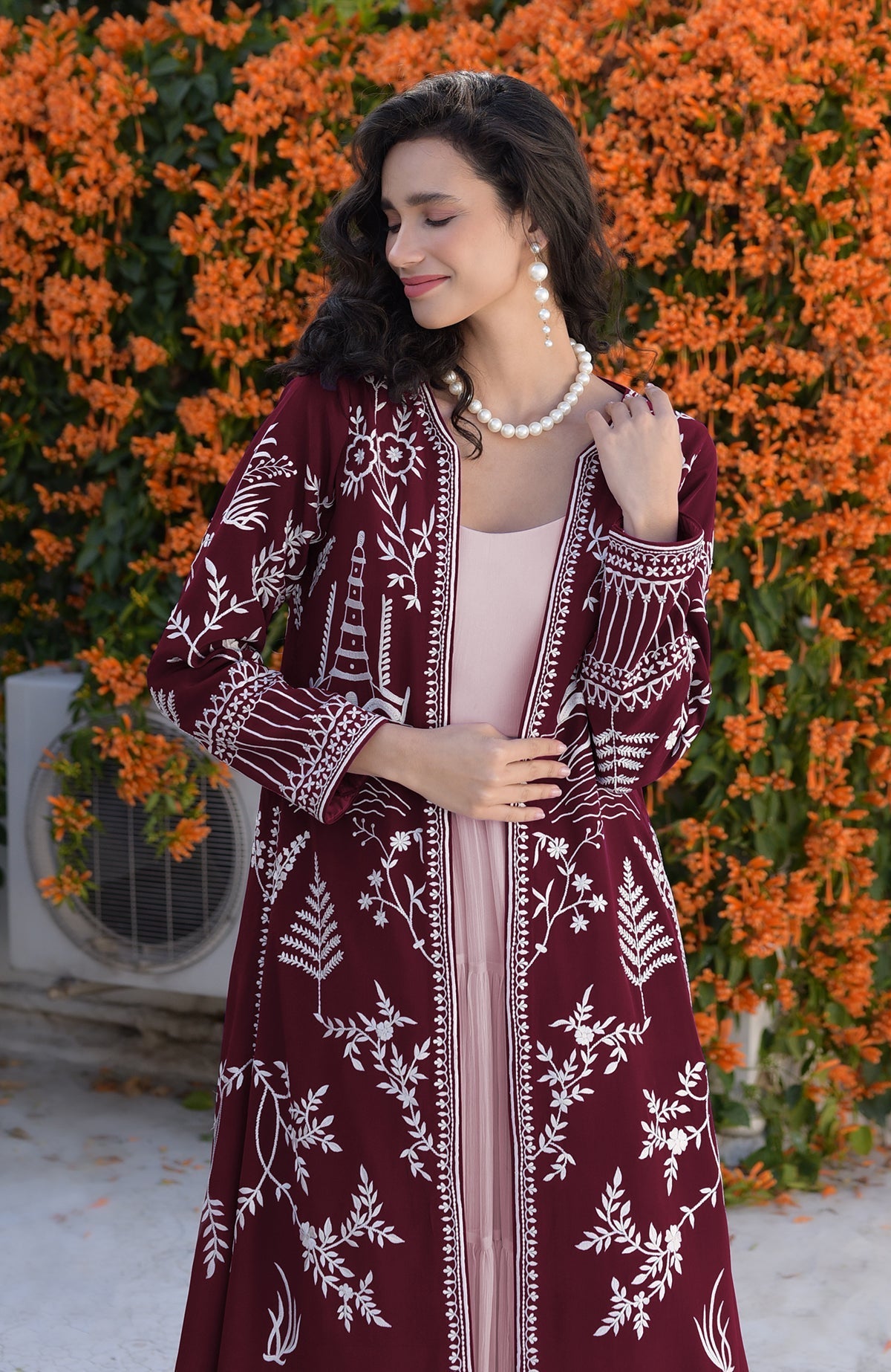 Emerald green Parsi Gara jacket with ivory embroidery paired with sage green micropleated chiffon dress