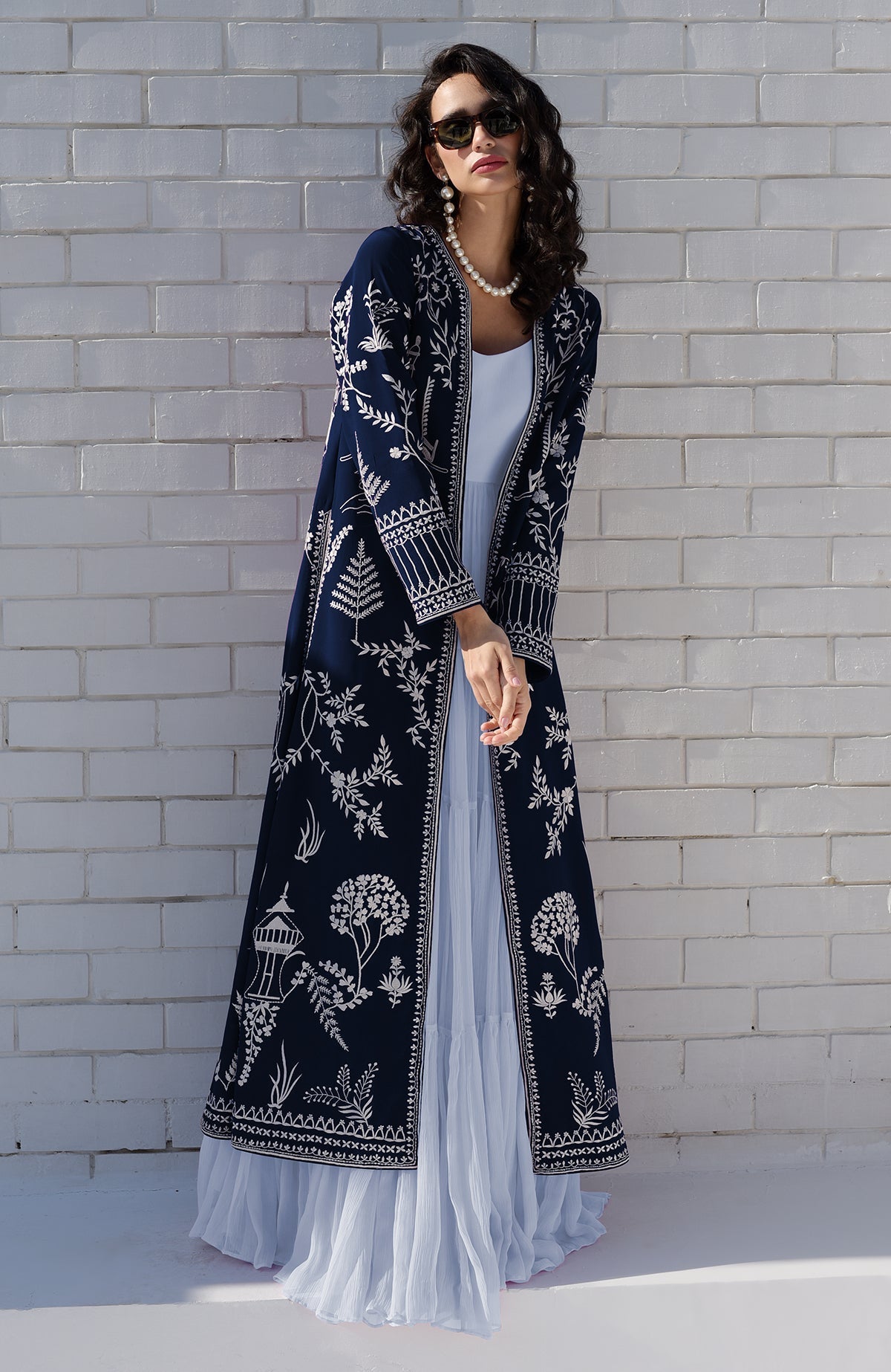 Navy blue Parsi Gara jacket with ivory embroidery paired with powder blue micropleated chiffon dress