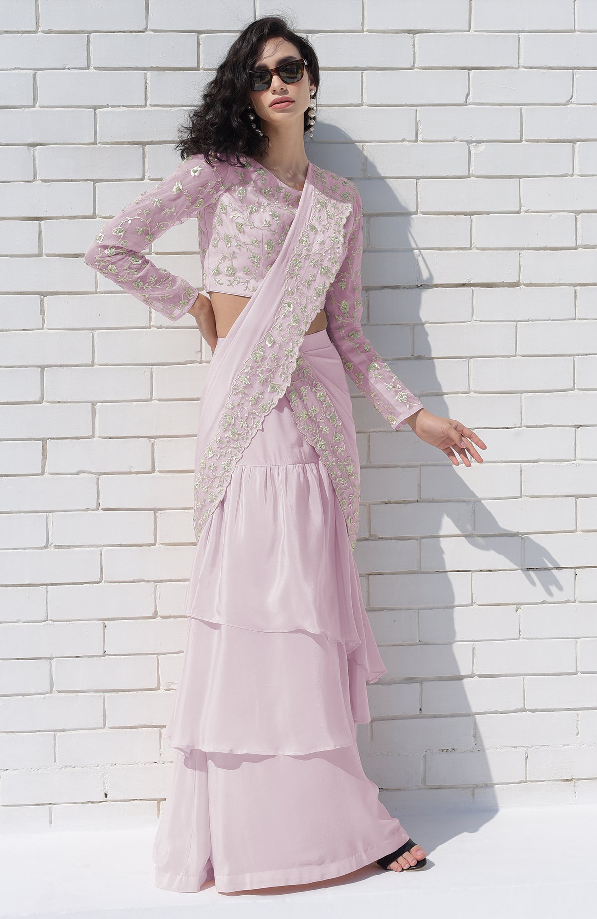 Sage green draped saree set with silver floral embroidery.