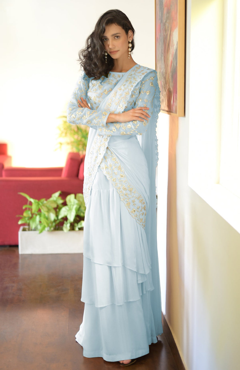 Aqua blue draped saree set with silver floral embroidery.