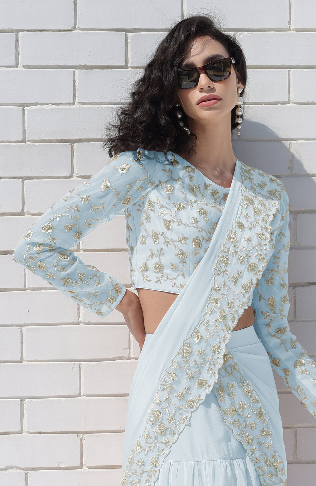 Aqua blue draped saree set with silver floral embroidery.