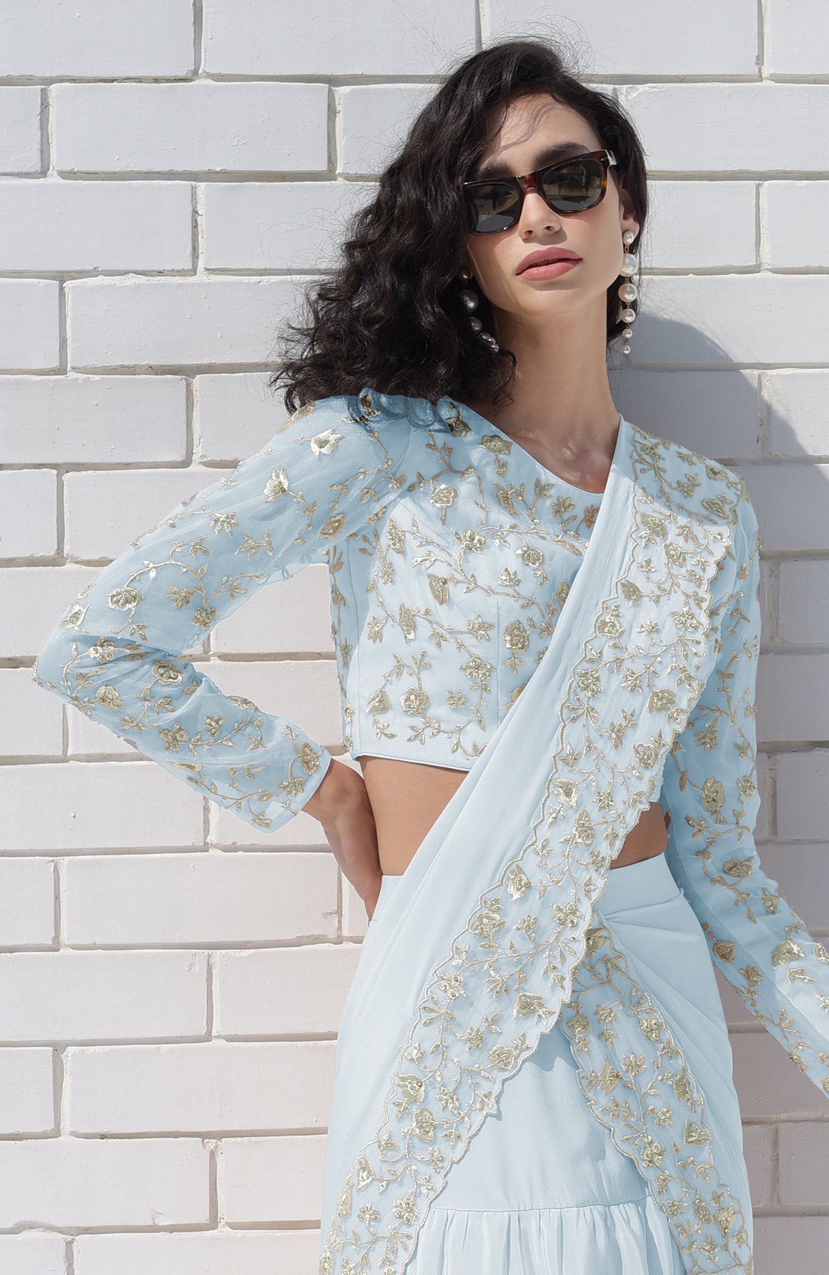 Aqua blue draped saree set with silver floral embroidery.