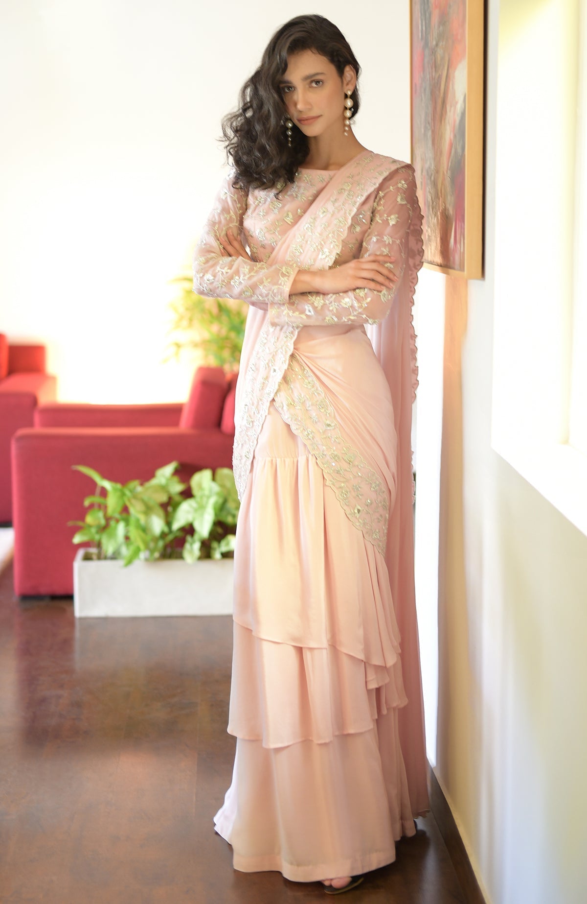 Sage green draped saree set with silver floral embroidery.