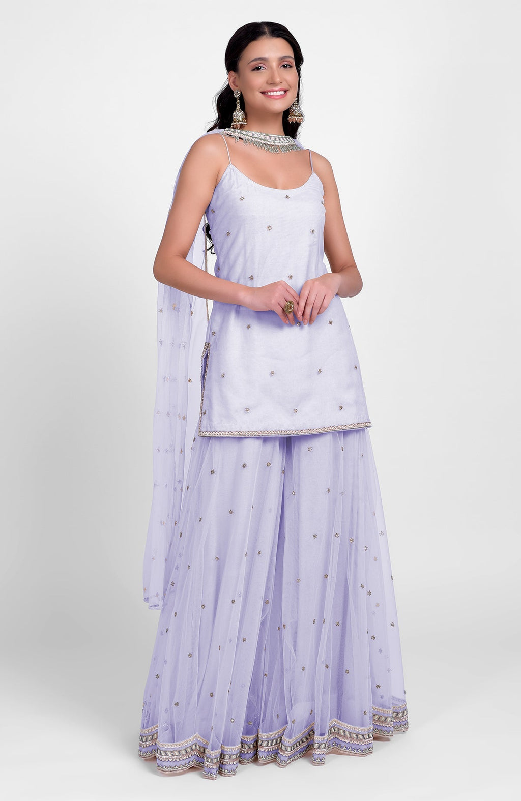Lilac sharara set with bead sequins, hand embroidery, flared kurta, and tulle dupatta.