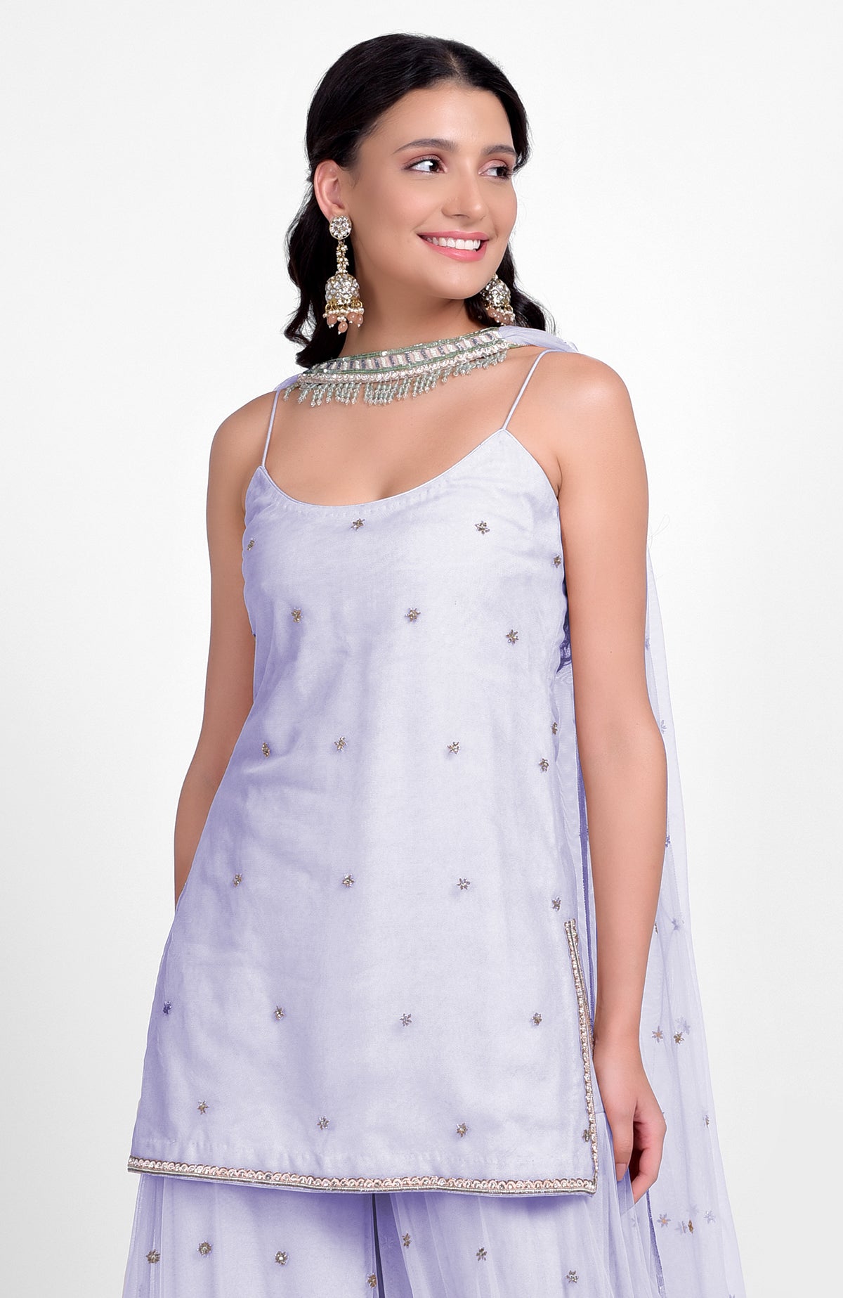 Lilac sharara set with bead sequins, hand embroidery, flared kurta, and jeweled tulle dupatta.