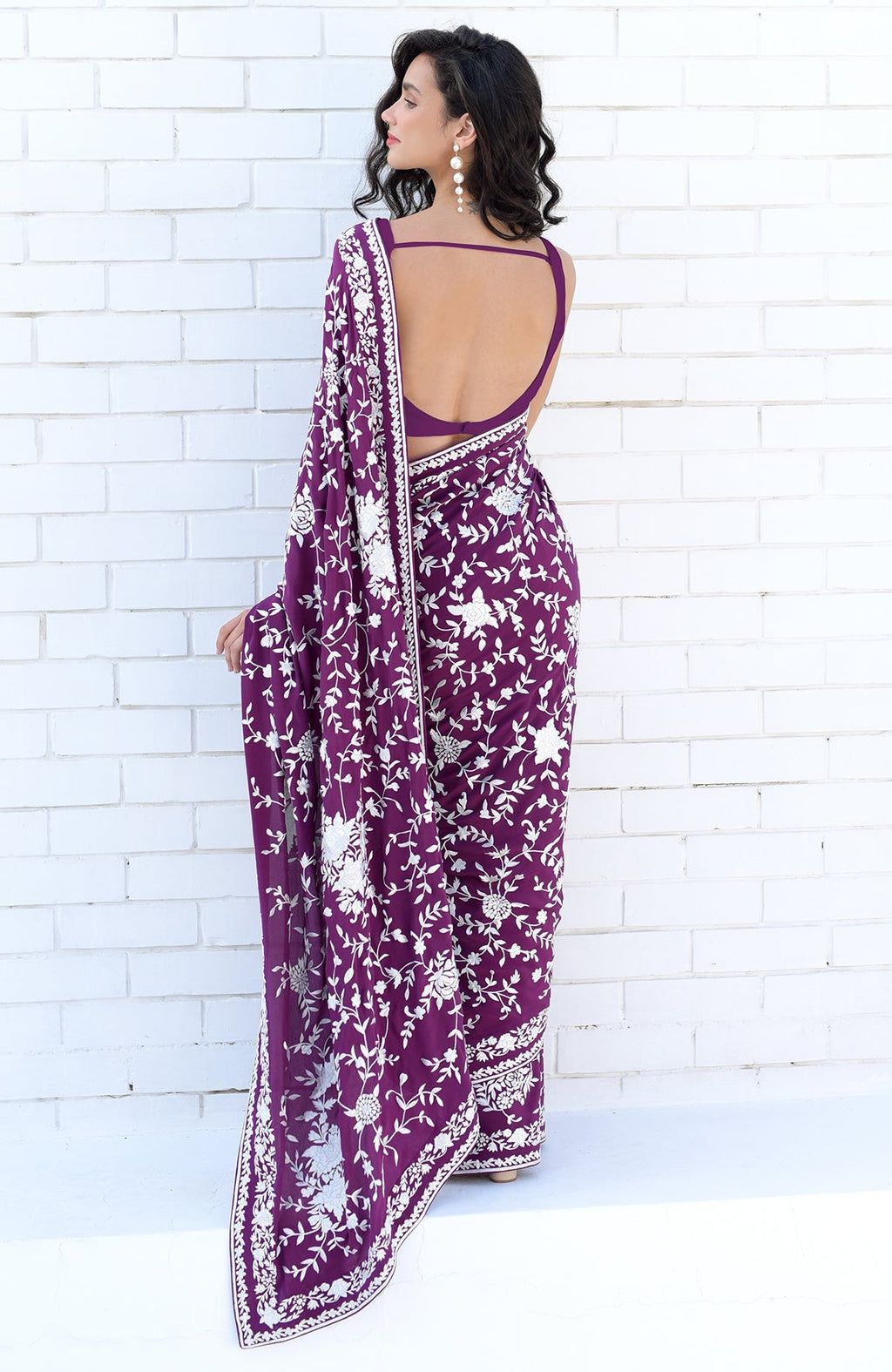 Purple saree with hand embroidered white floral Parsi Gara double borders and matching blouse piece.