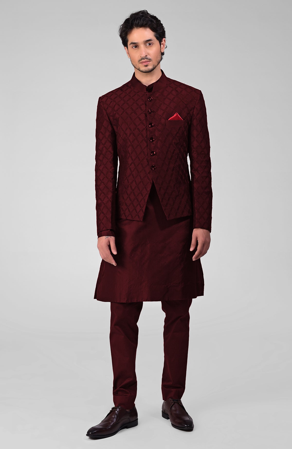 Navy blue raw silk Bandhgala jacket with intricate chikankari floral embroidery and matching kurta set