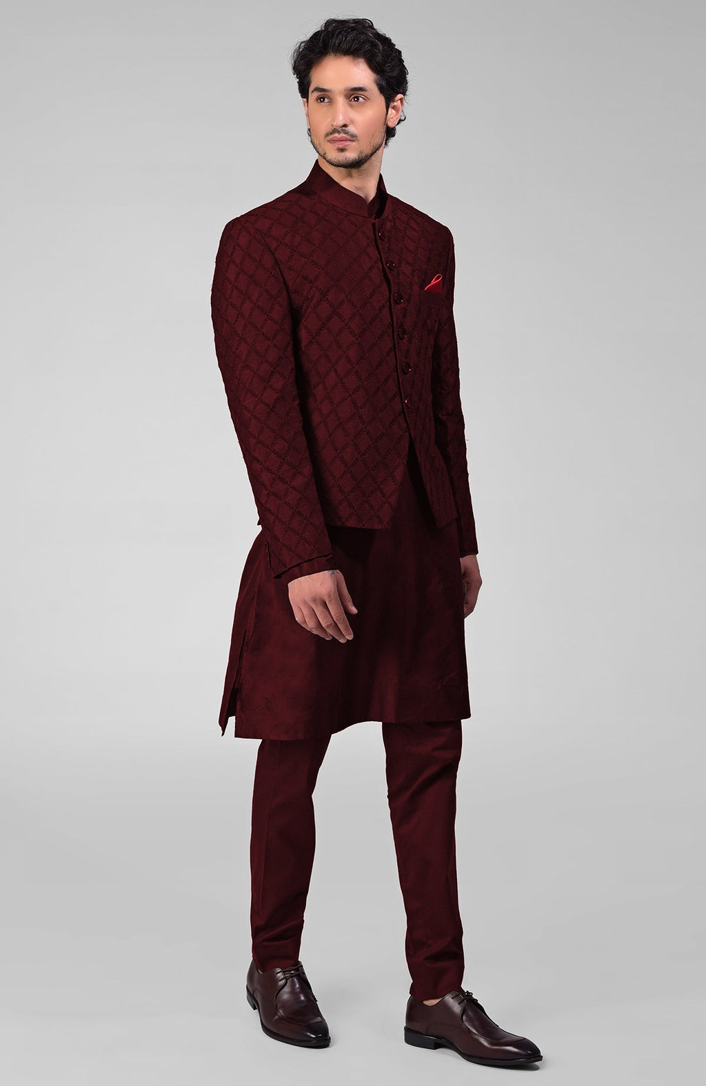 Maroon raw silk bandhgala jacket with geometric floral embroidery all over.