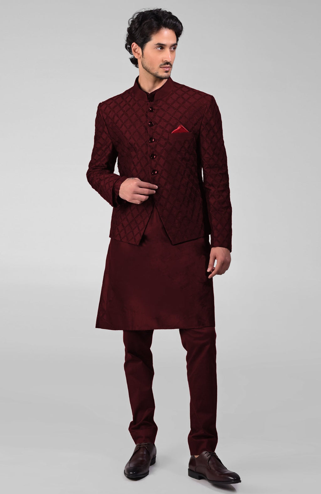 Maroon raw silk bandhgala jacket with geometric floral embroidery all over.