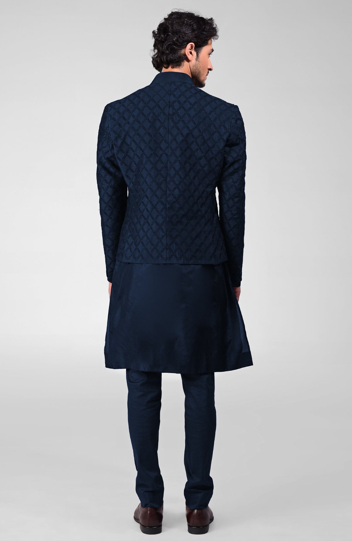 Navy blue raw silk bandhgala jacket with geometric floral embroidery all over.