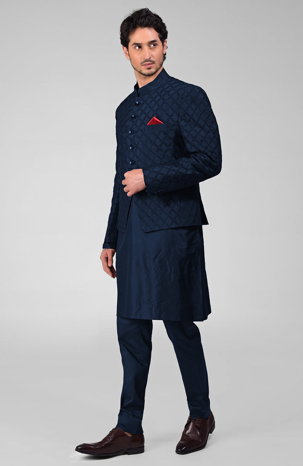 Navy blue raw silk bandhgala jacket with geometric floral embroidery all over.