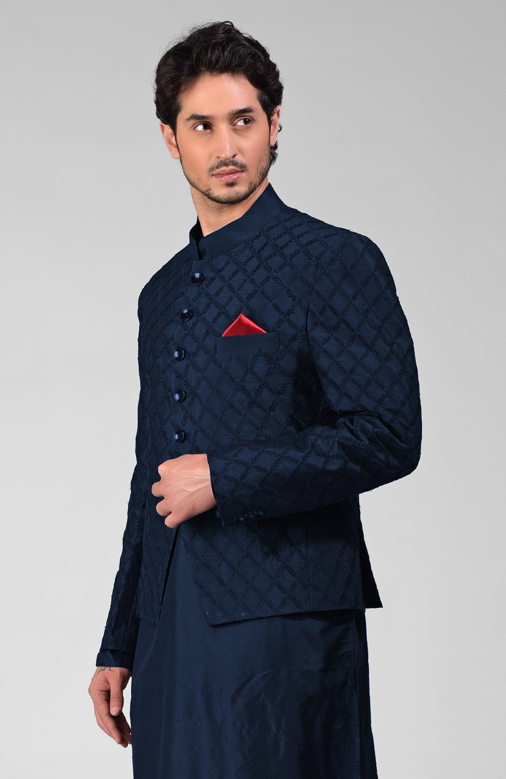 Navy blue raw silk bandhgala jacket with all-over geometric floral embroidery.