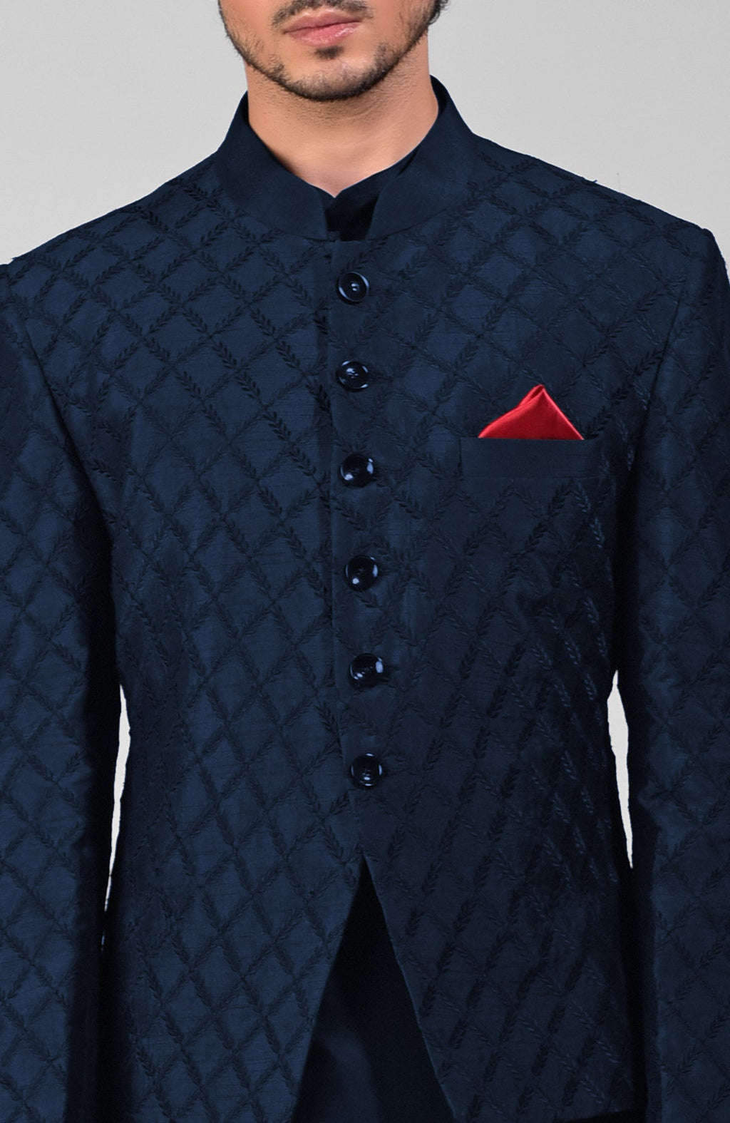 Navy blue raw silk Bandhgala jacket with intricate chikankari floral embroidery in a three-piece set