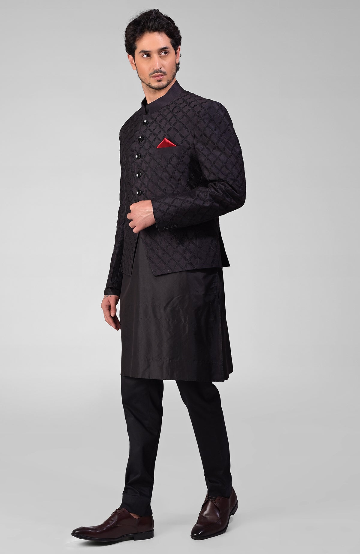 Black silk Bandhgala jacket with intricate chikankari embroidery in a tonal floral design.