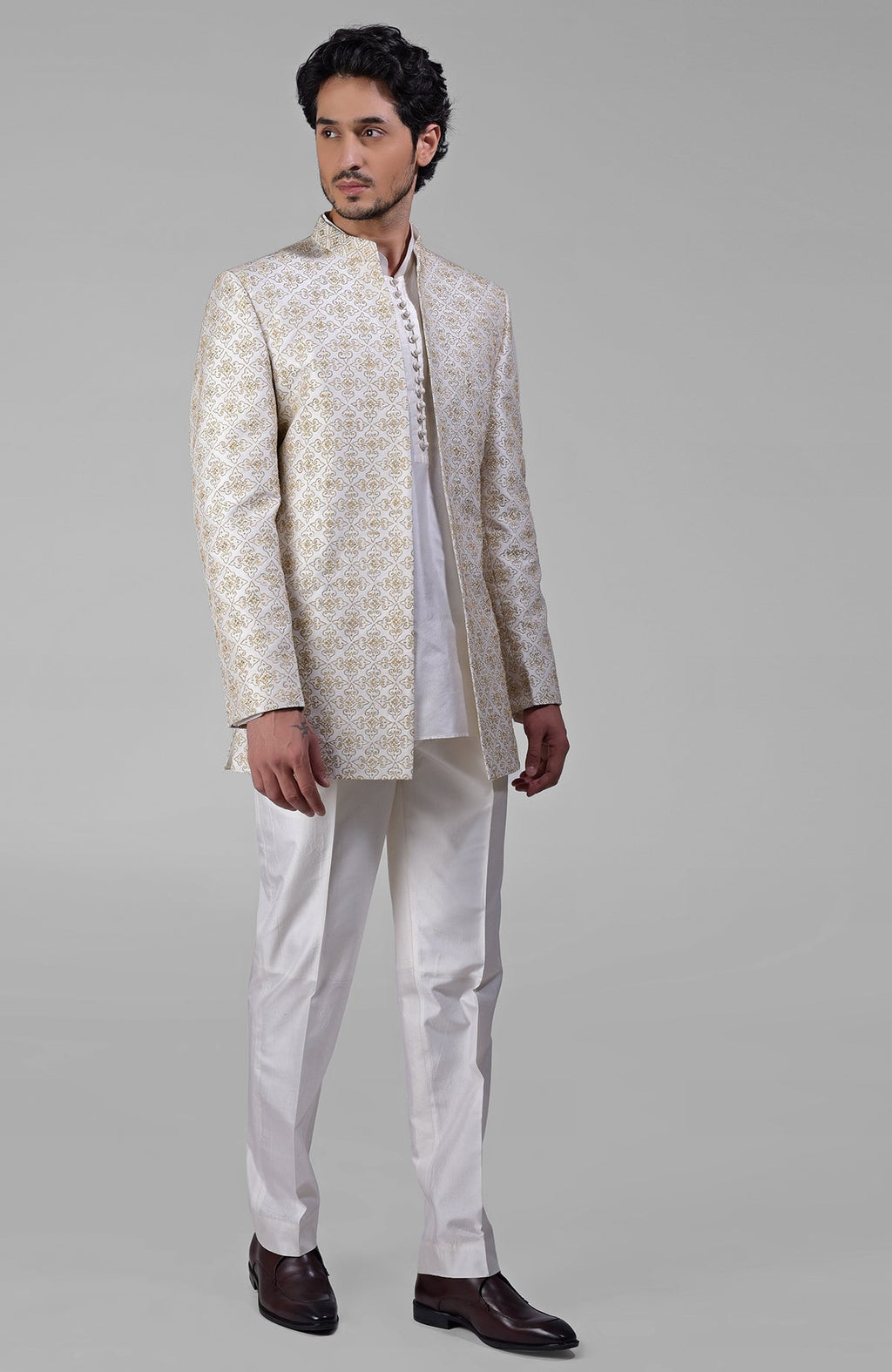 Ivory silk jacket set with gold embroidery, open jacket, short kurta, and slim pants.