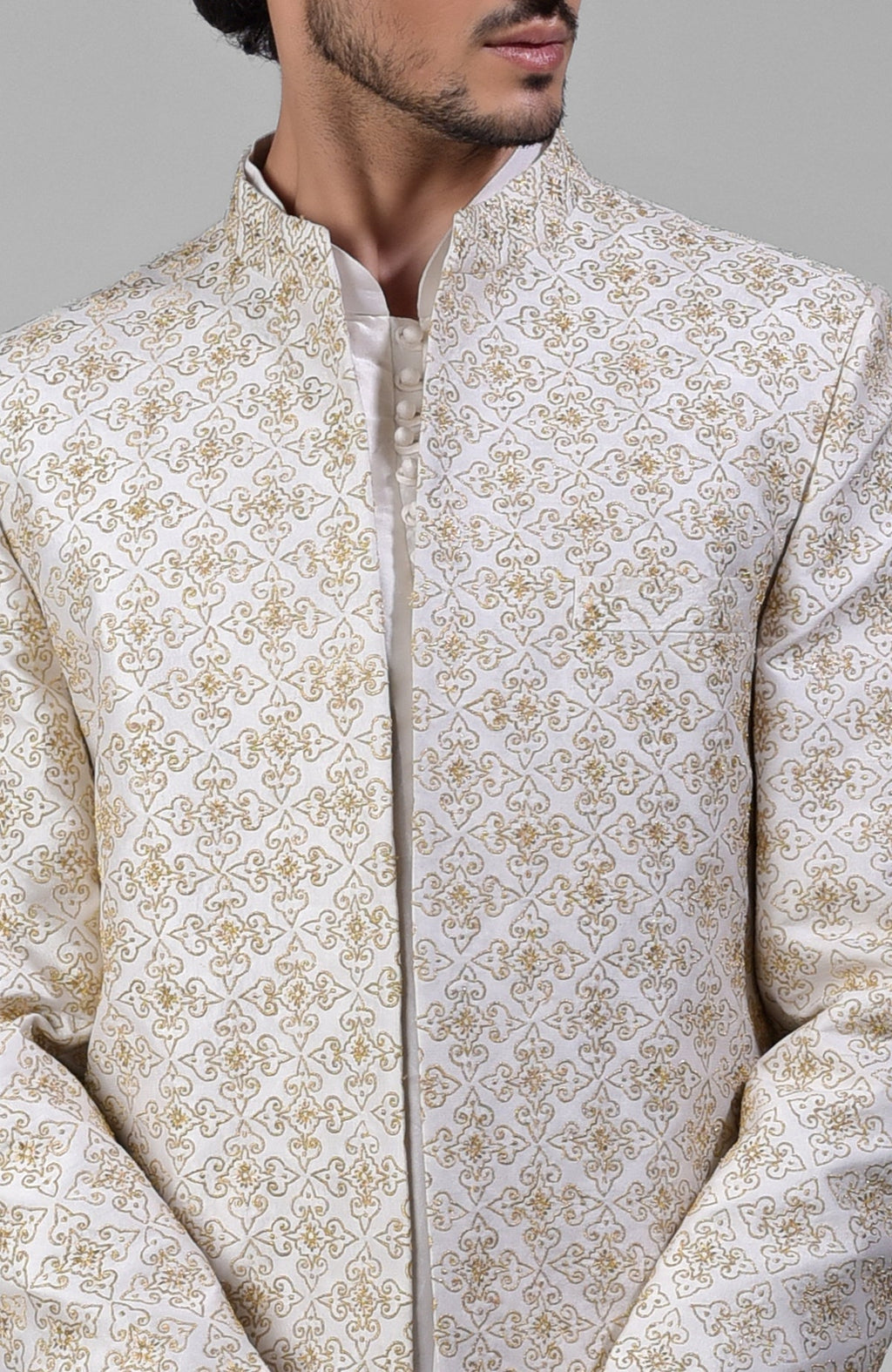 Ivory silk jacket set with gold embroidery, open jacket, short kurta, and slim pants.