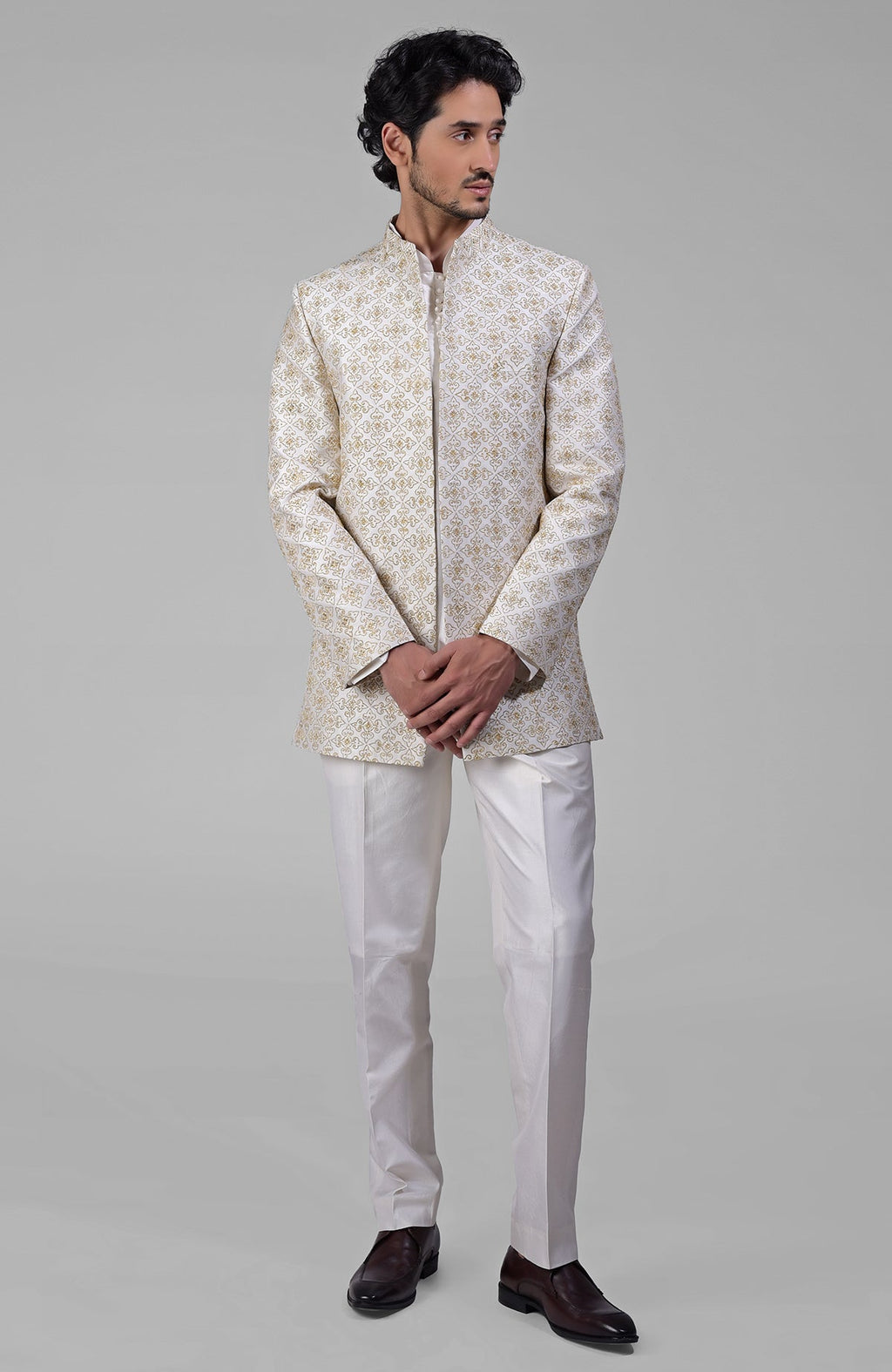 Ivory silk jacket set with gold embroidery, open jacket, short kurta, and slim pants.