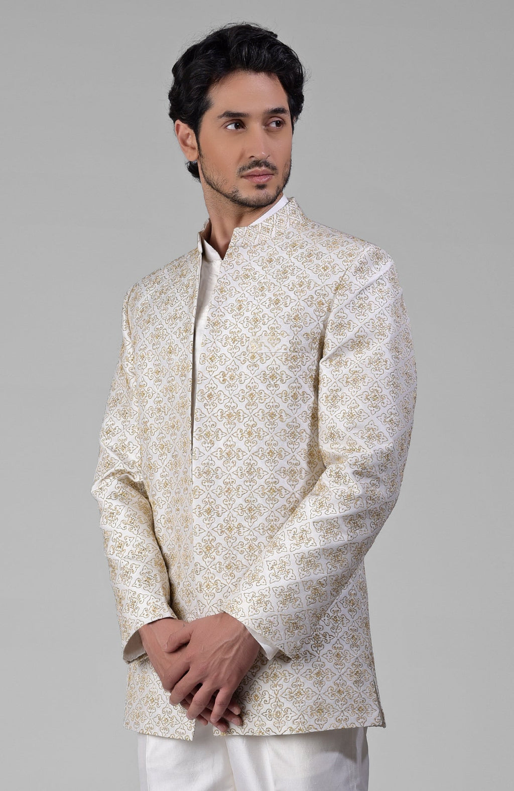 Ivory gold embroidered silk jacket set with open jacket, short kurta, and slim pants.