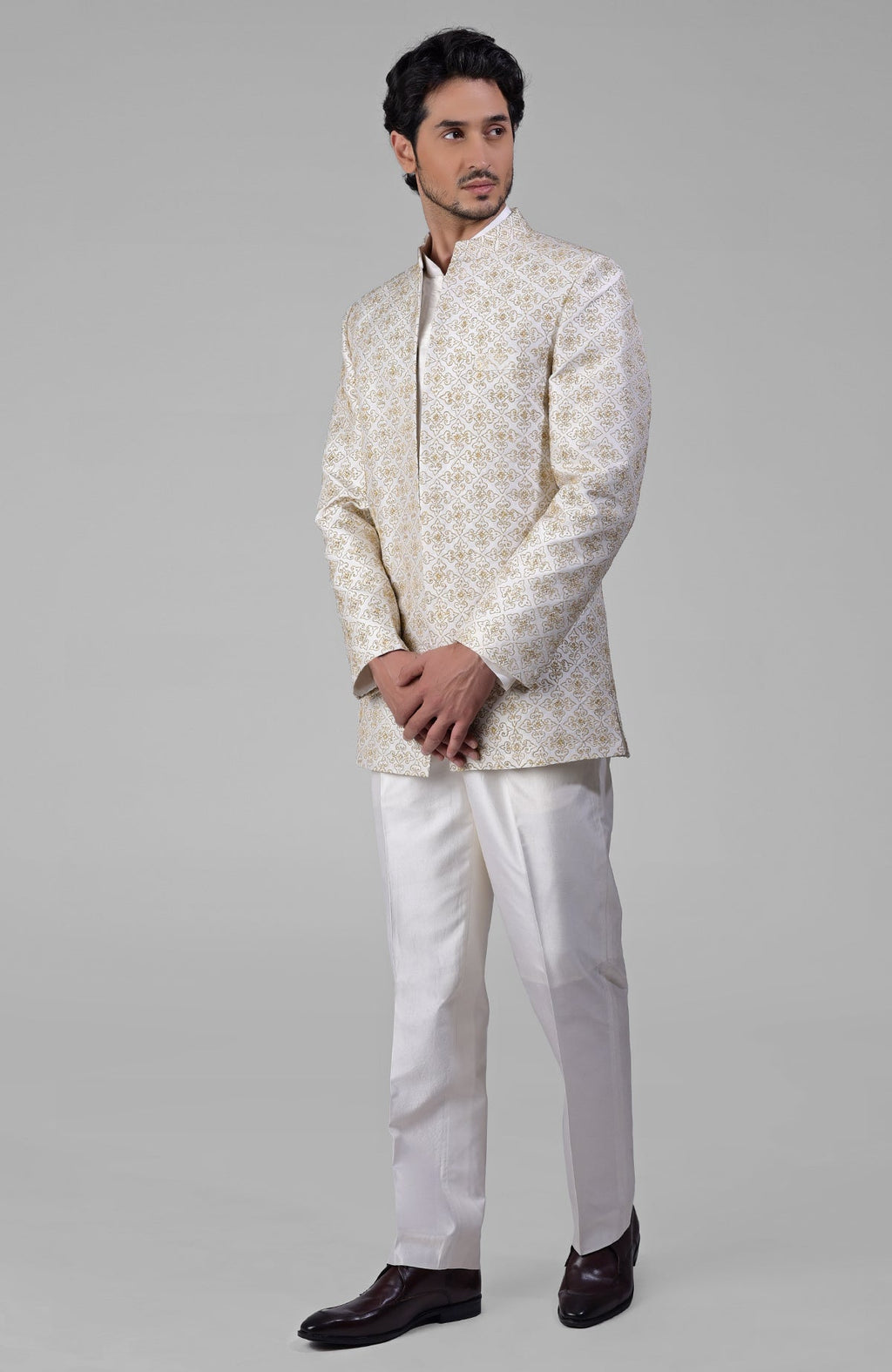 Ivory silk jacket set with gold embroidery, open jacket, short kurta, and slim pants.