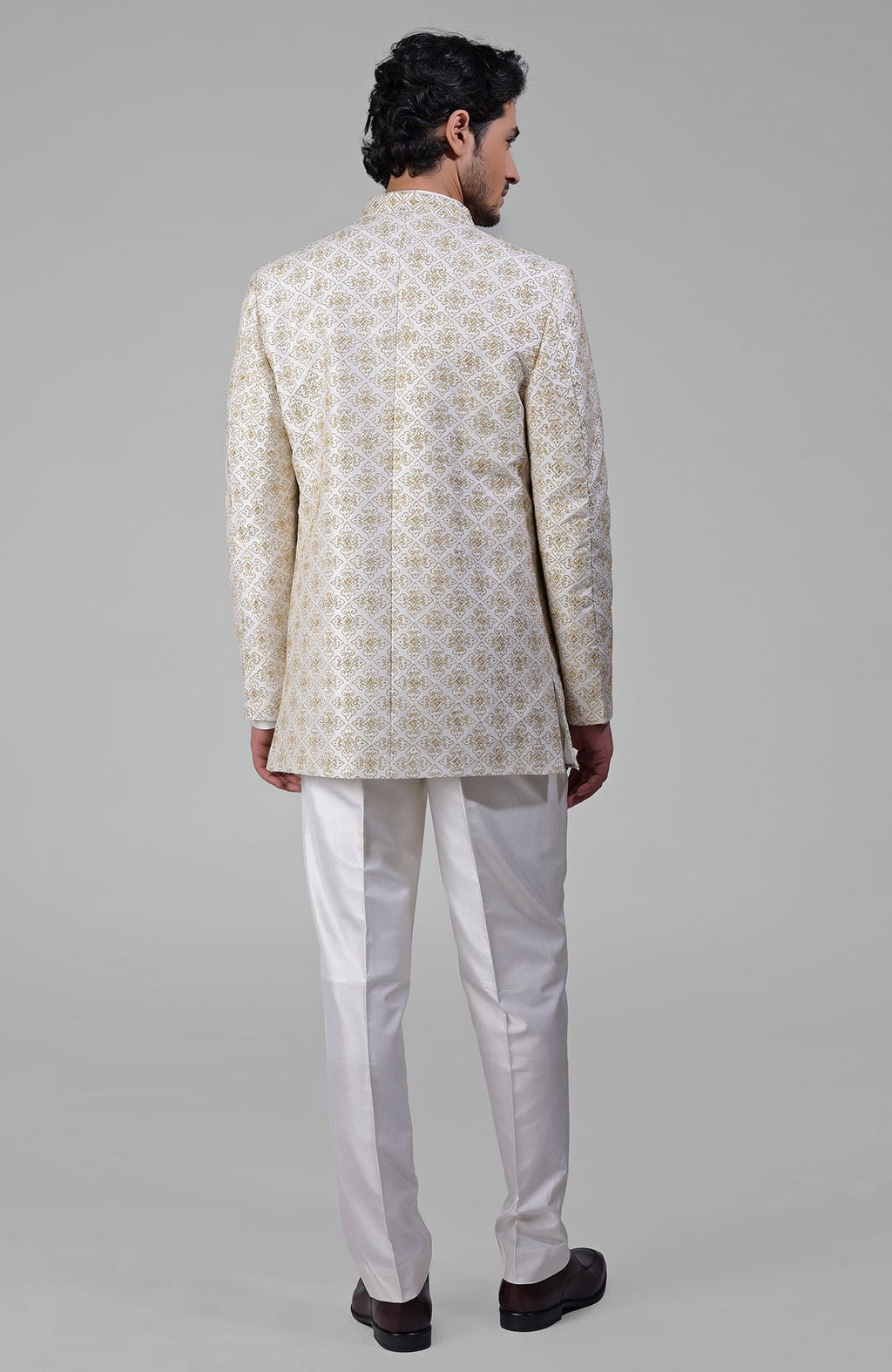 Ivory silk jacket set with gold embroidery, open jacket, short kurta, and slim pants.