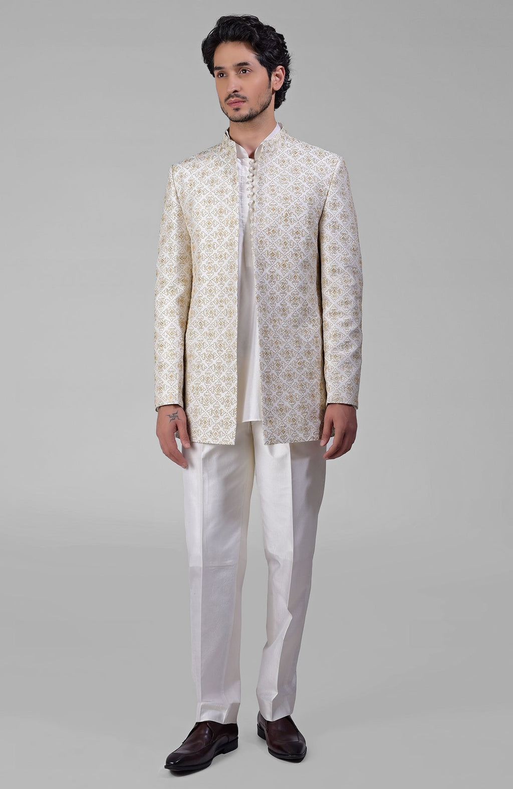 Ivory silk jacket set with gold embroidery, open jacket, short kurta, and slim pants.