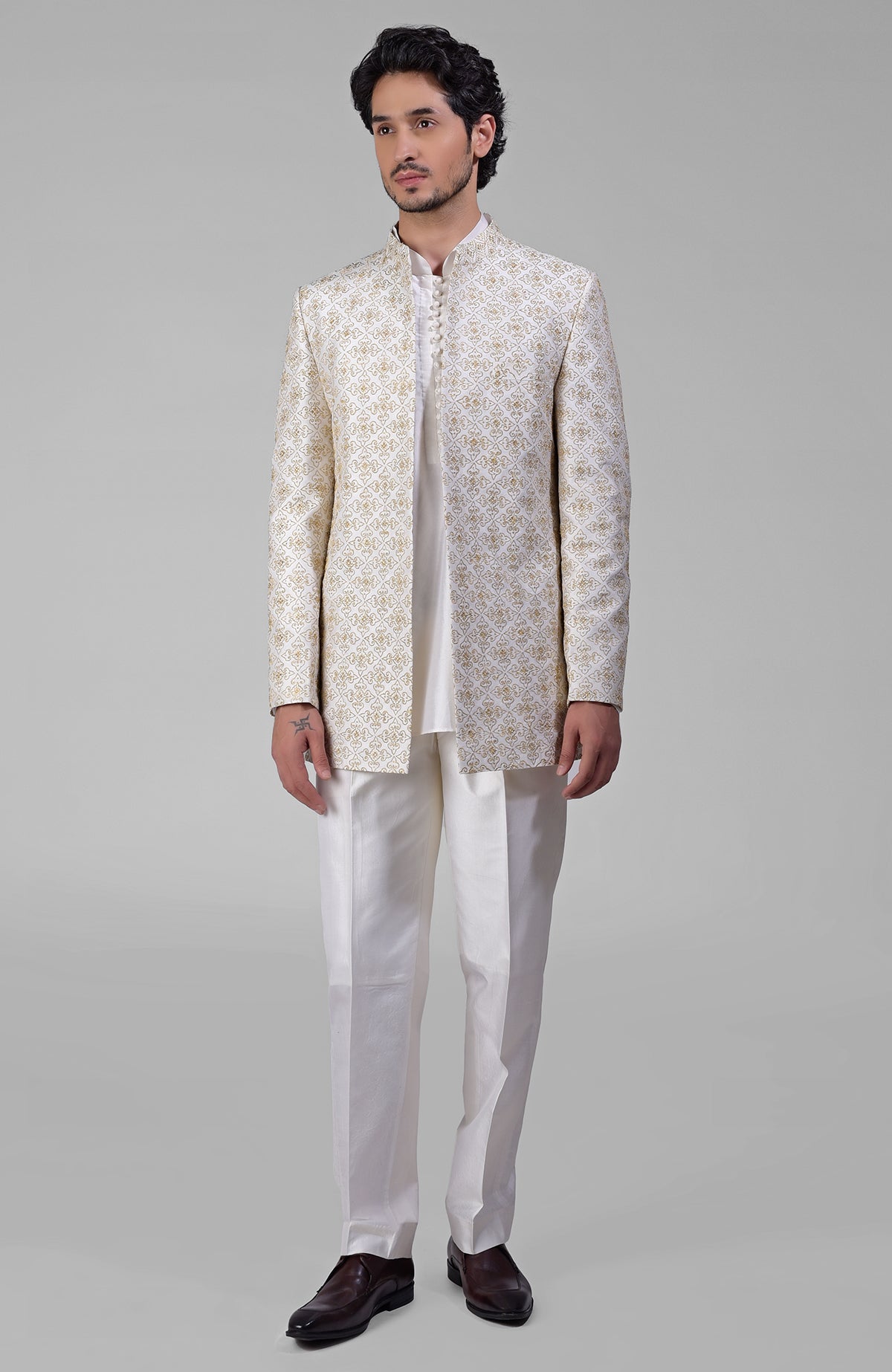 Ivory silk jacket set with gold embroidery, open jacket, short kurta, and slim pants.