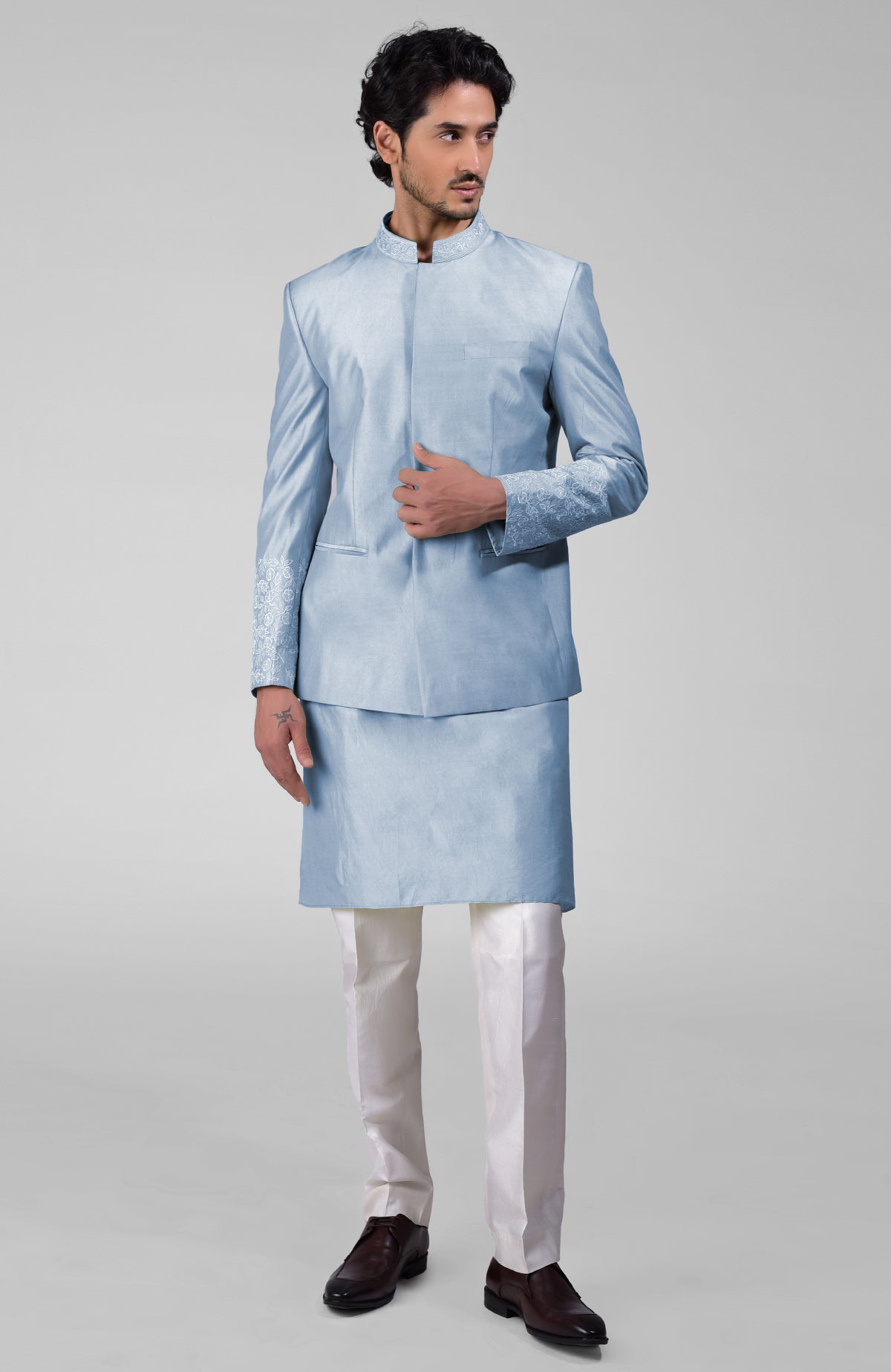 Sage green three-piece set with embroidered bandhgala jacket, kurta, and pants in pure silk.