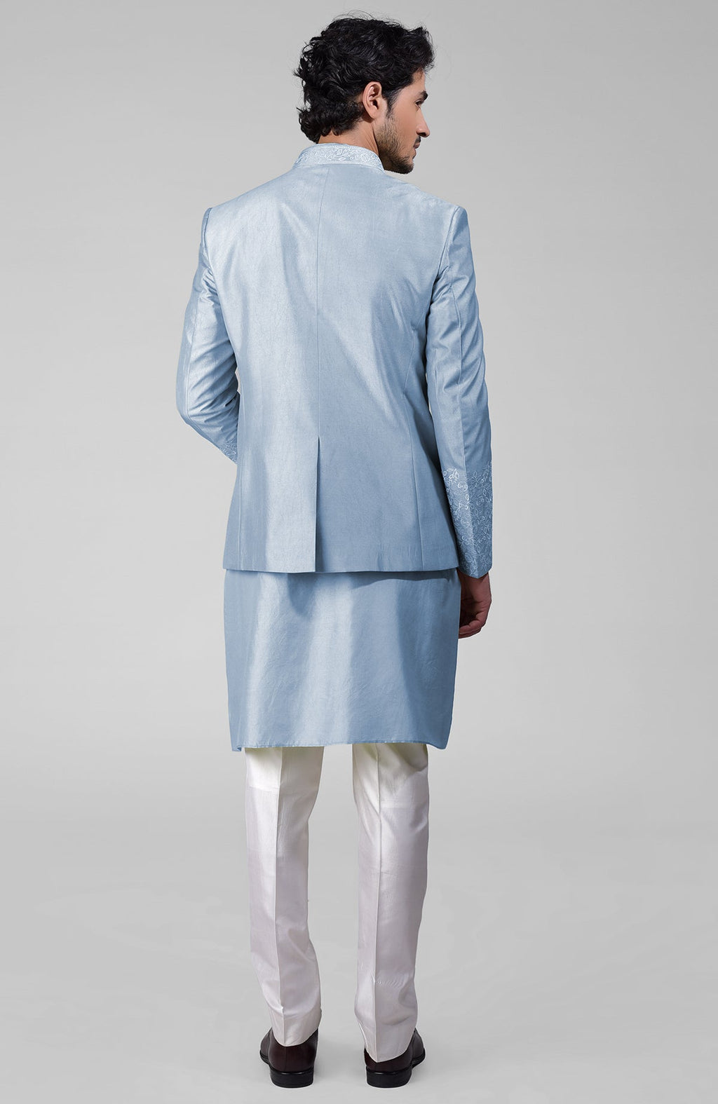 Dusty blue silk bandhgala jacket with thread embroidery, kurta, and pants set.