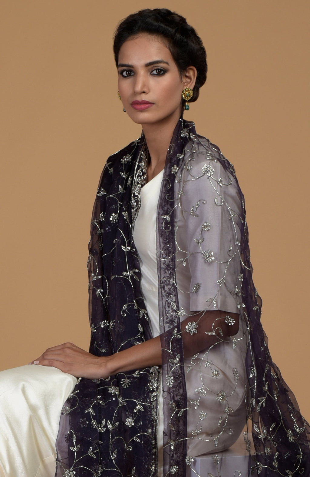 A woman models an Eclipse Blue Zardozi hand-embroidered dupatta with a suit.