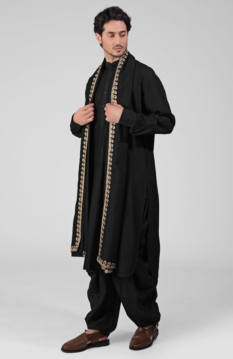 Scarlet red pintuck Kurta with Pathani salwar and gold tilla embroidered dupatta.
