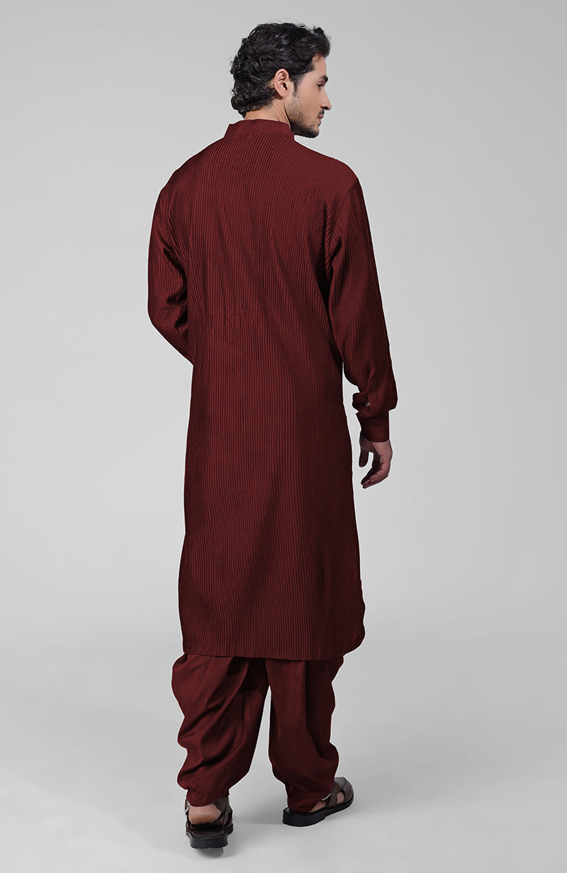 Maroon pintuck Pathani kurta with matching salwar and gold tilla embroidered dupatta.