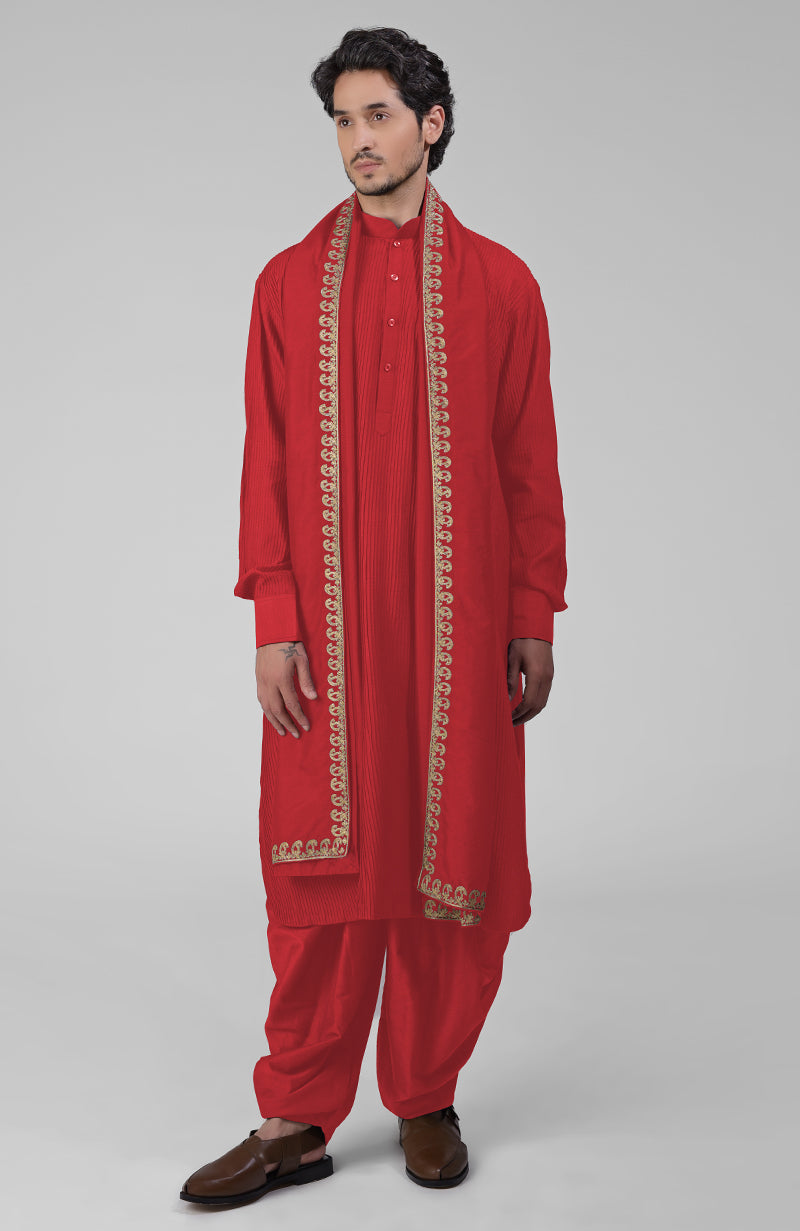 Maroon pintuck Pathani kurta with matching salwar and gold tilla embroidered dupatta.