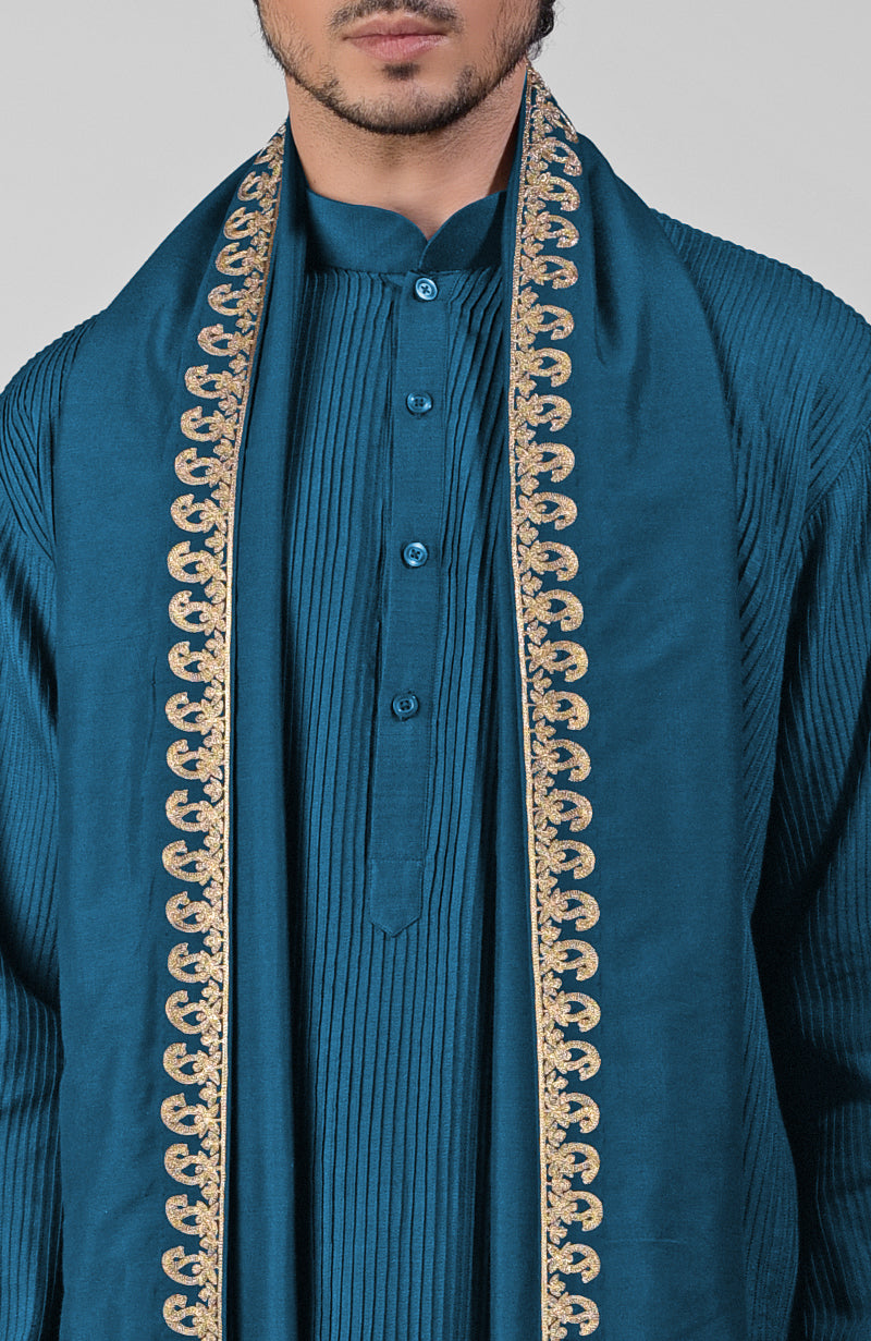Teal pintuck Pathani kurta with matching salwar and gold tilla embroidered dupatta.