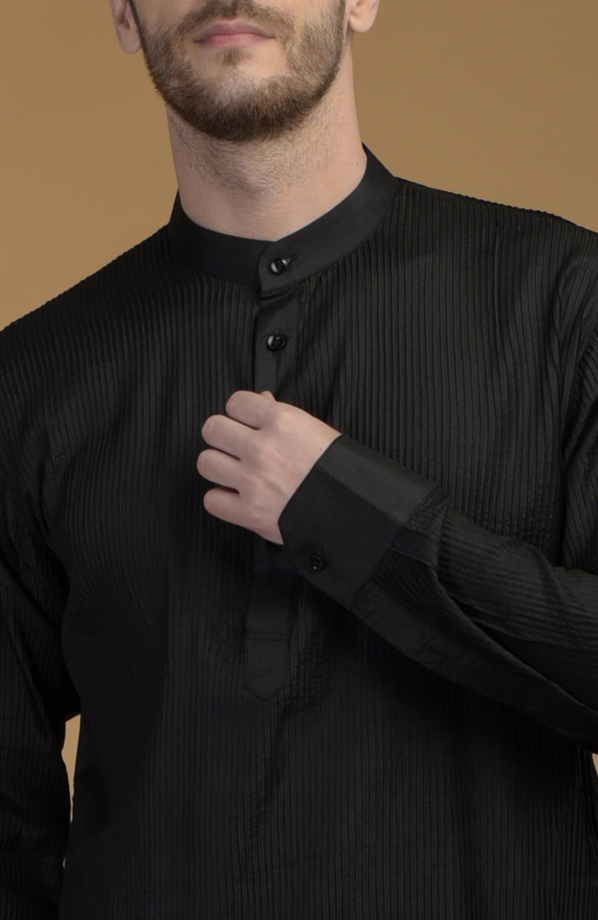 Classic black silk Pathani kurta with pintuck details.