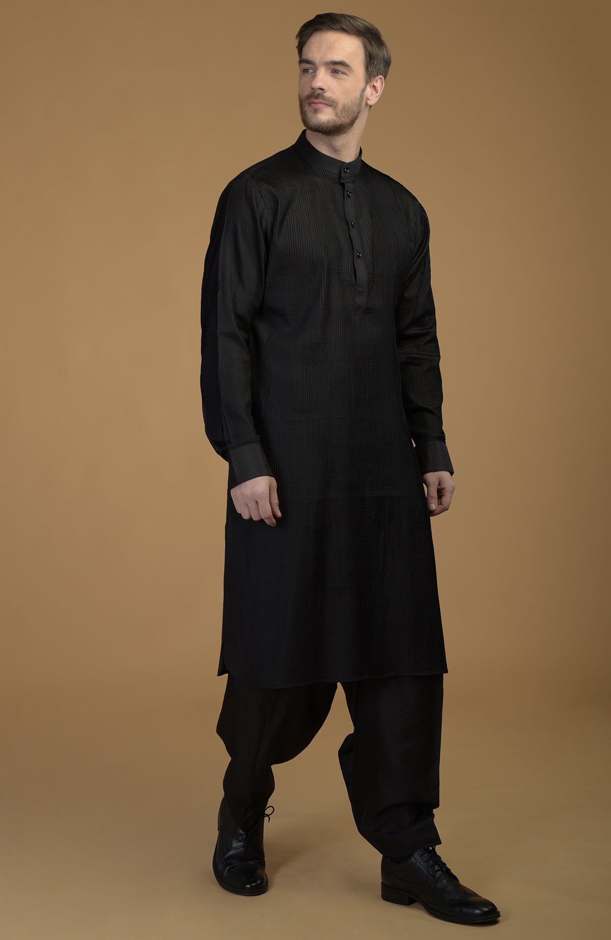 Classic black silk Pathani kurta set with pintuck details.