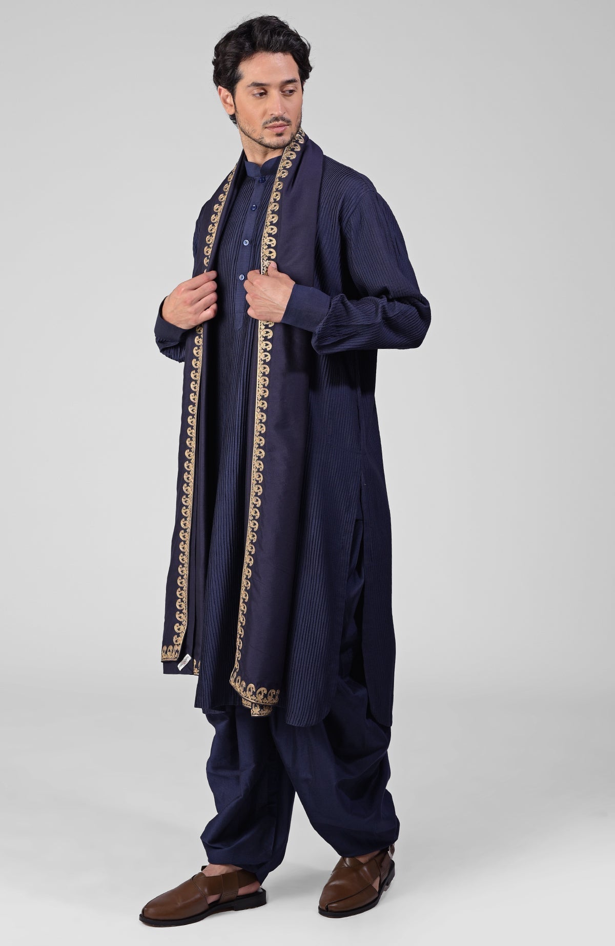 Scarlet red pintuck Kurta with Pathani salwar and gold tilla embroidered dupatta.