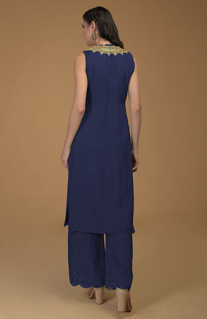 Navy blue kurta set with gold zardozi embroidery and scalloped hem pants.