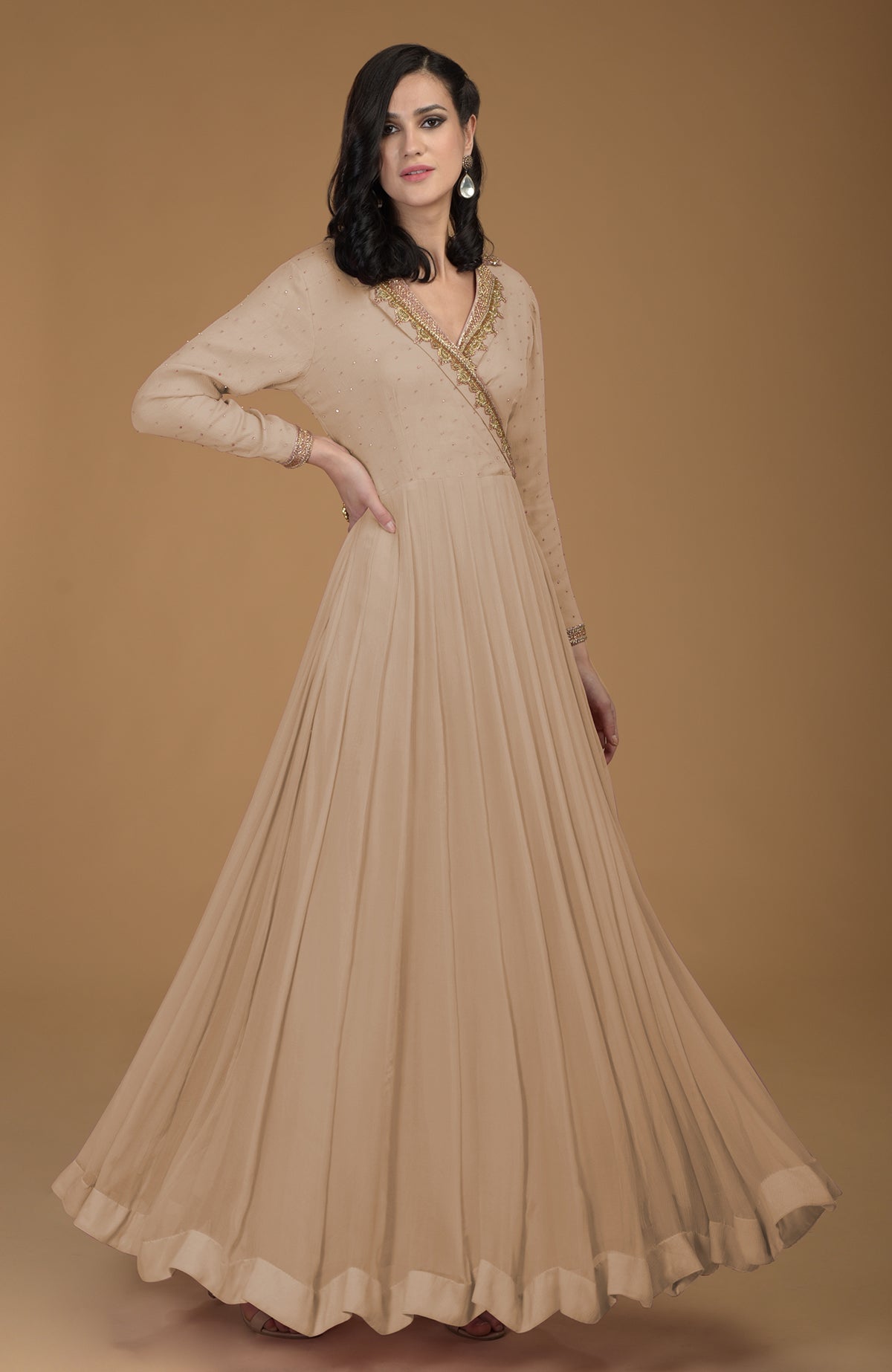 Beige chiffon kalidaar dress with gold zardozi embroidery on bodice, collar, and sleeves.