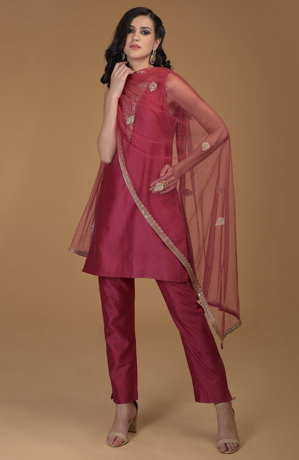 Ruby red zardozi hand embroidered suit with a sheer dupatta and matching pants.