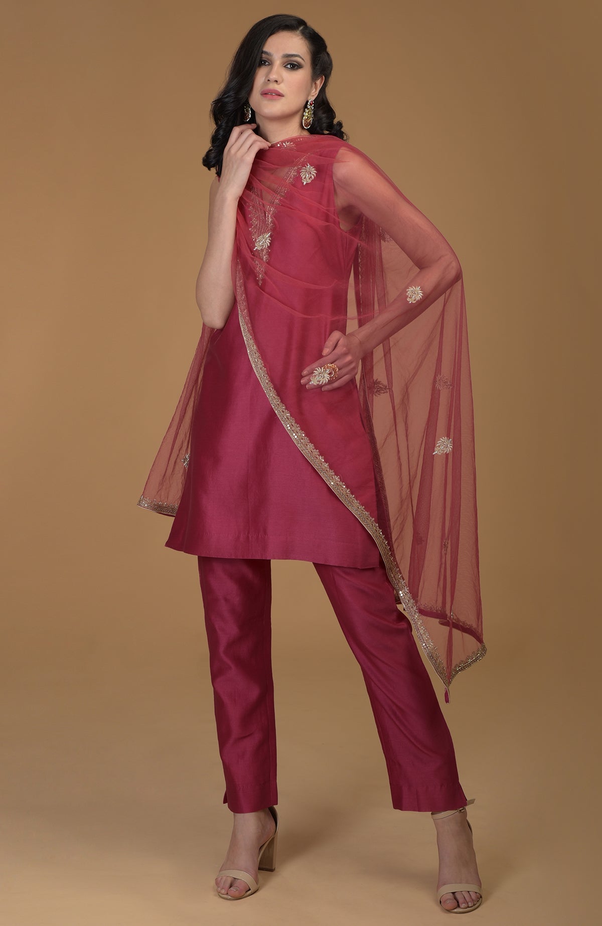 Ruby red zardozi hand embroidered suit with a sheer dupatta and matching pants.